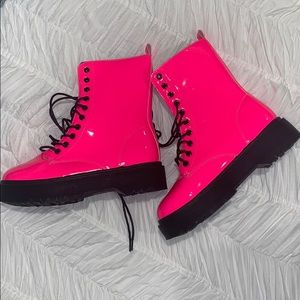 Neon pink combat boots